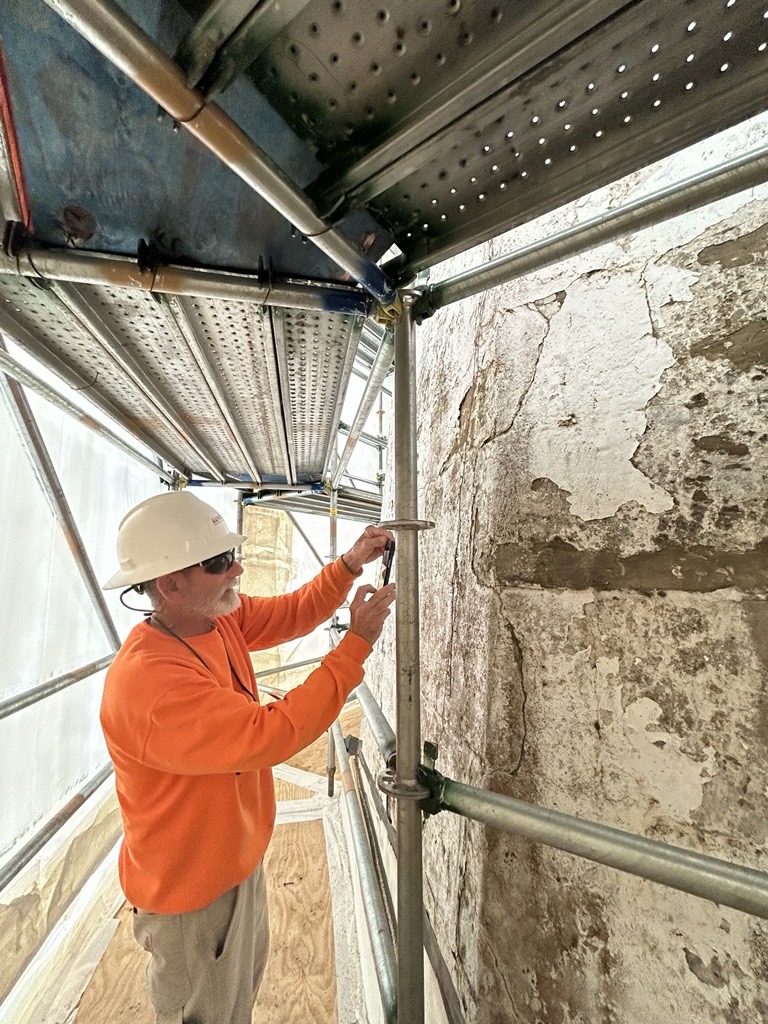 Hana Senior Environmental Engineer Marc Gutterman works on the tower of the Old Comfort Point Lighthouse. (Photo/Hana Engineers)