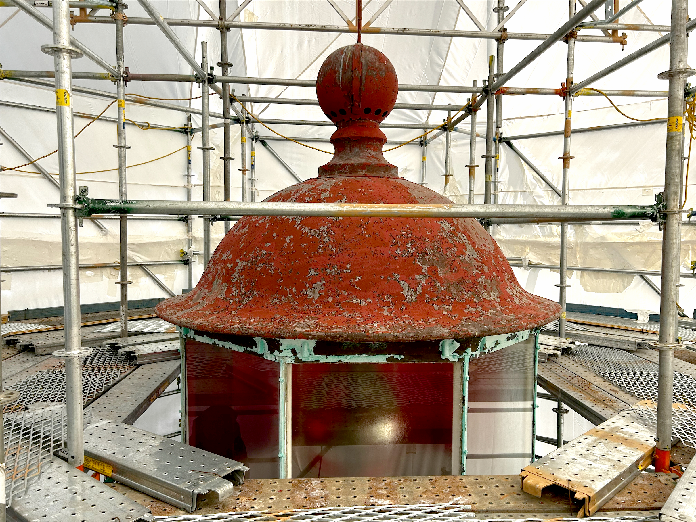 The Old Point Comfort Lighthouse dome at 58 feet tall undergoes remediation work. (Photo/Hana Engineers)